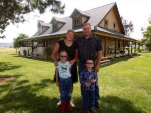 Erik Klann and family on his Prineville farm